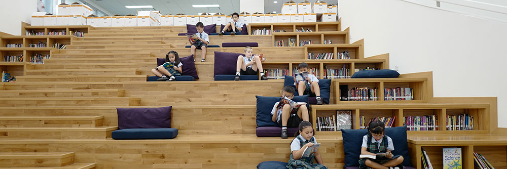 Image of Malvern College pupils reading in a library